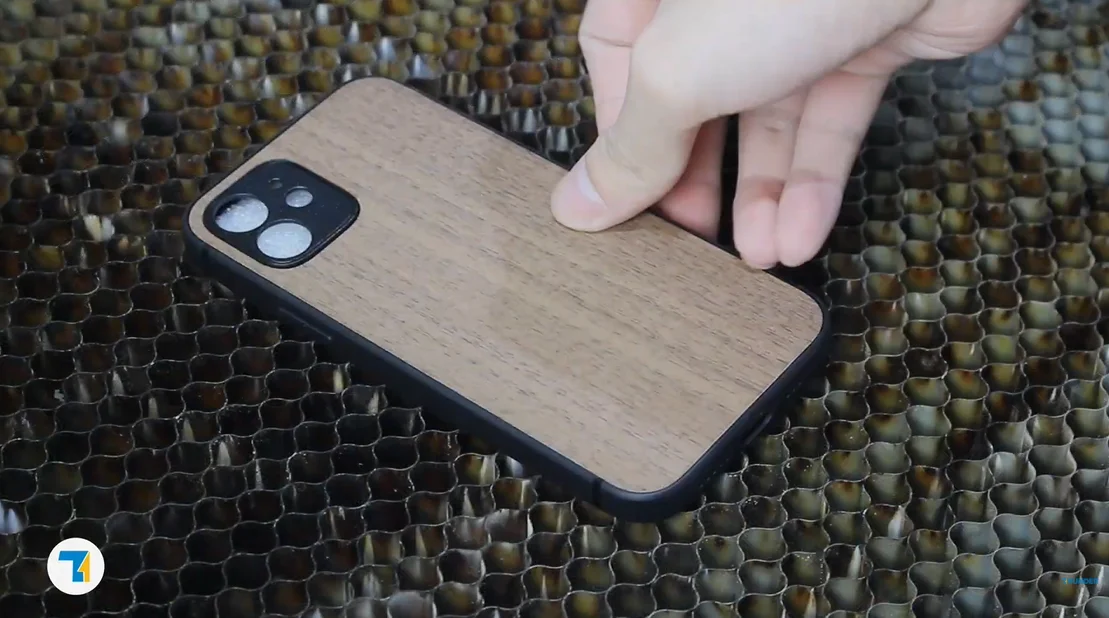 put the phone case on the laser bed.webp