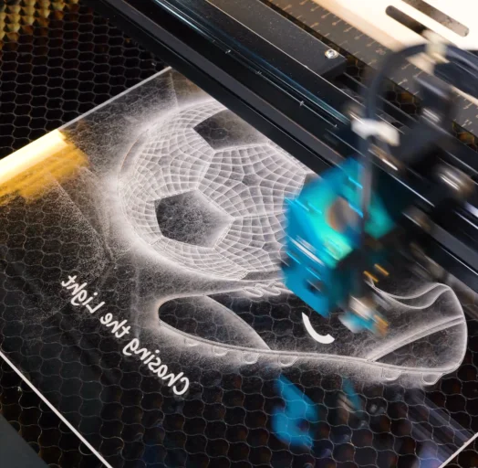 laser engraving the soccer night light.webp