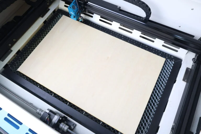 put the material on the laser bed