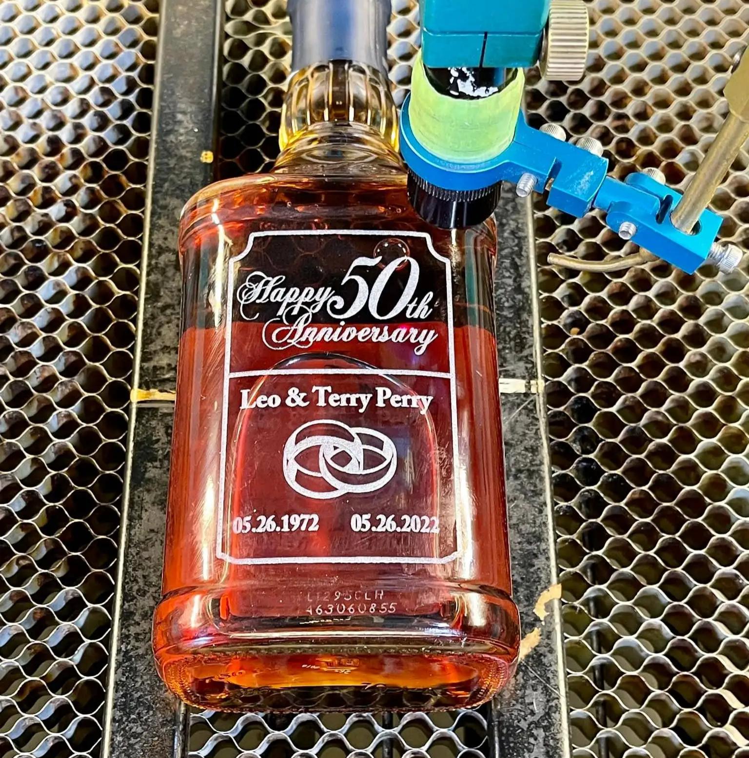 laser engraved glass bottle with fine details